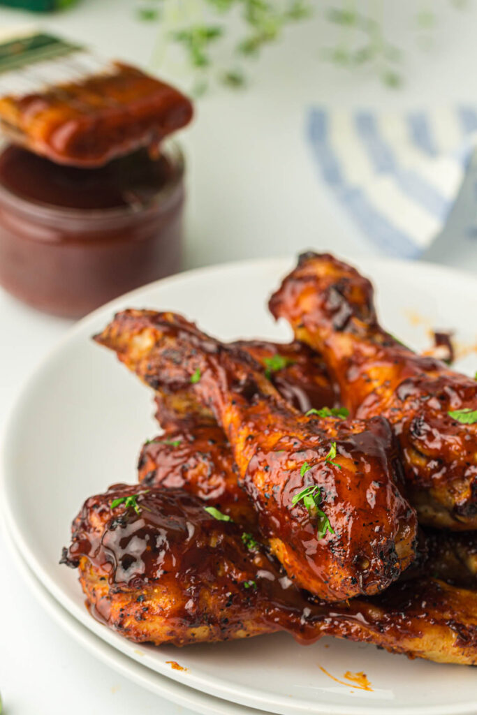 Cooked chicken legs on a plate.