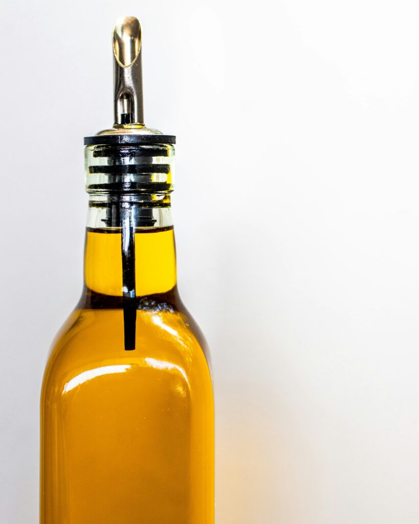 A pouring bottle of olive oil.