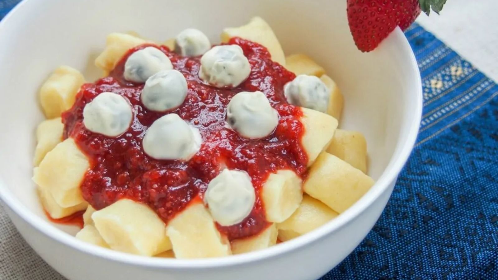 Dessert gnocchi with balsamic strawberry sauce